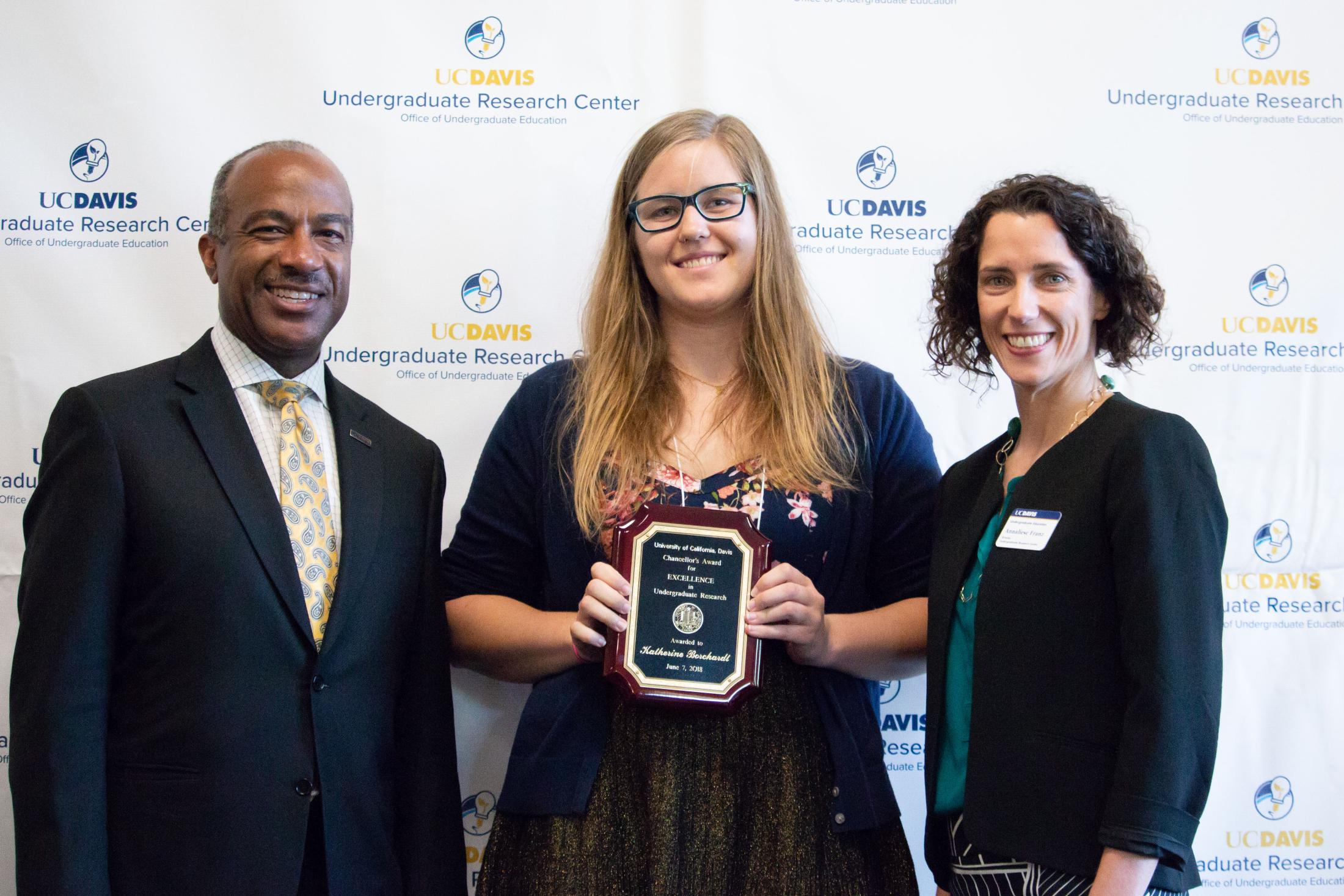 Kate Borchardt stands with UC Davis Chancellor Gary May and Associate Professor Annaliese Franz. Daniel Oberbauer 