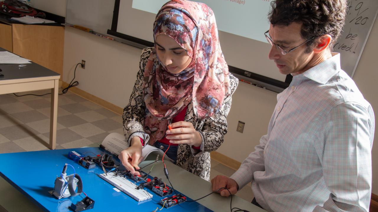 Mark Goldman and a student