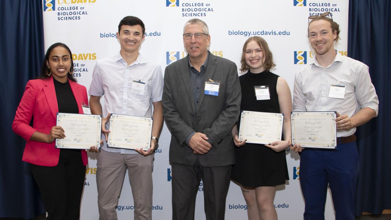 A group shot of the top graduate award recipients with the CBS dean