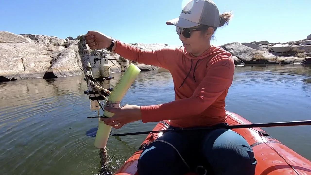 Female student on a red kayak