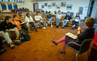 Multiple UC Davis students sit facing a facilitator as part of a focus group sponsored by Student Affairs