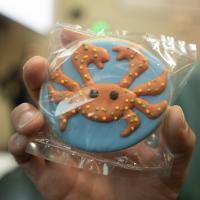 Closeup of cookie with crab decoration.