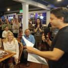 Darren Peck, a morning weather anchor for FOX40, announces the winners for the second Sacramento Science Idol held in January. Bobby Castagna