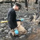 Dustin Lower collecting soil samples from regions impacted by fire.