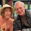 Mark and Marsha leaning into one another in a restaurant 
